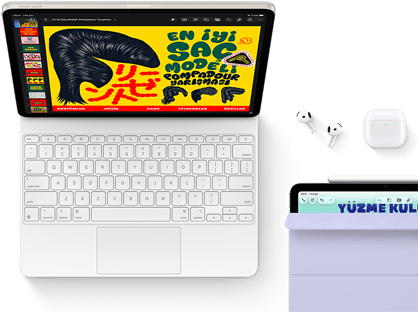 Magic Keyboard’a takılı Yıldız Işığı rengi iPad Air’in ekranında renkli grafikler, Airpods Pro ve Apple Pencil Pro aksesuarları
